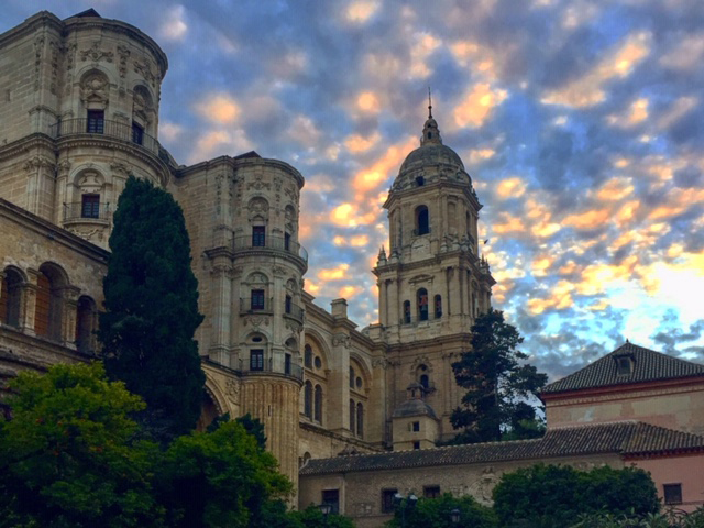 The one tower of the Malaga Cathedral during sunset.