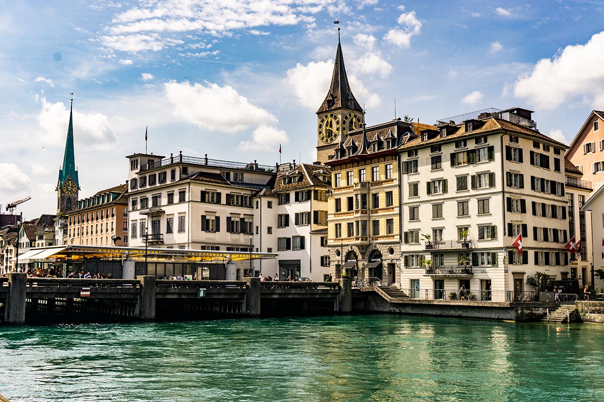 A view of the river and the warm colored city scape in Zurich, Switzerland.