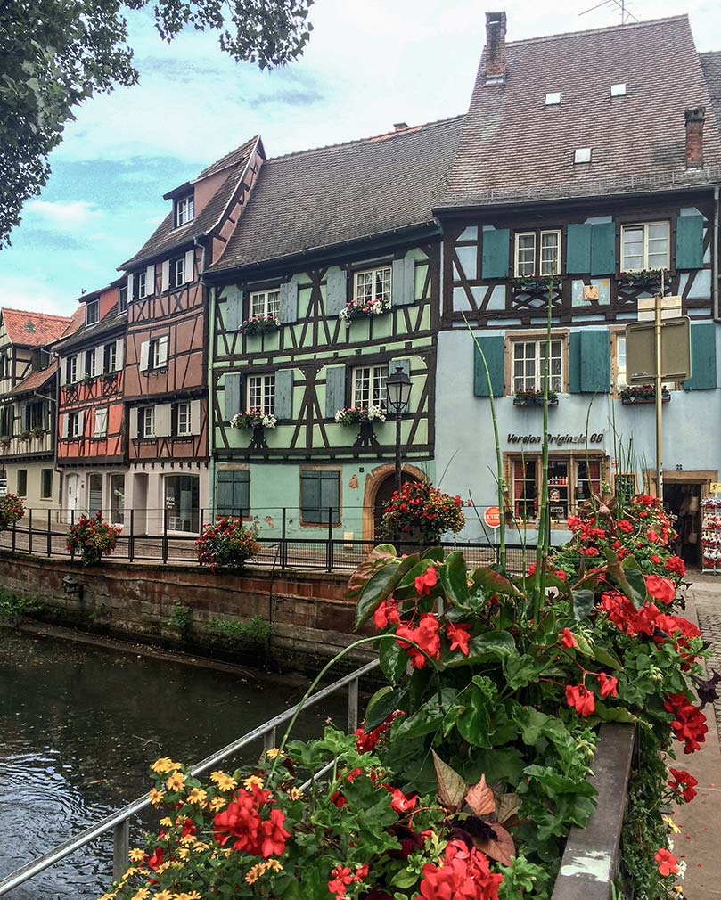 Colorful timbered houses located on a canal in Colmar, France.