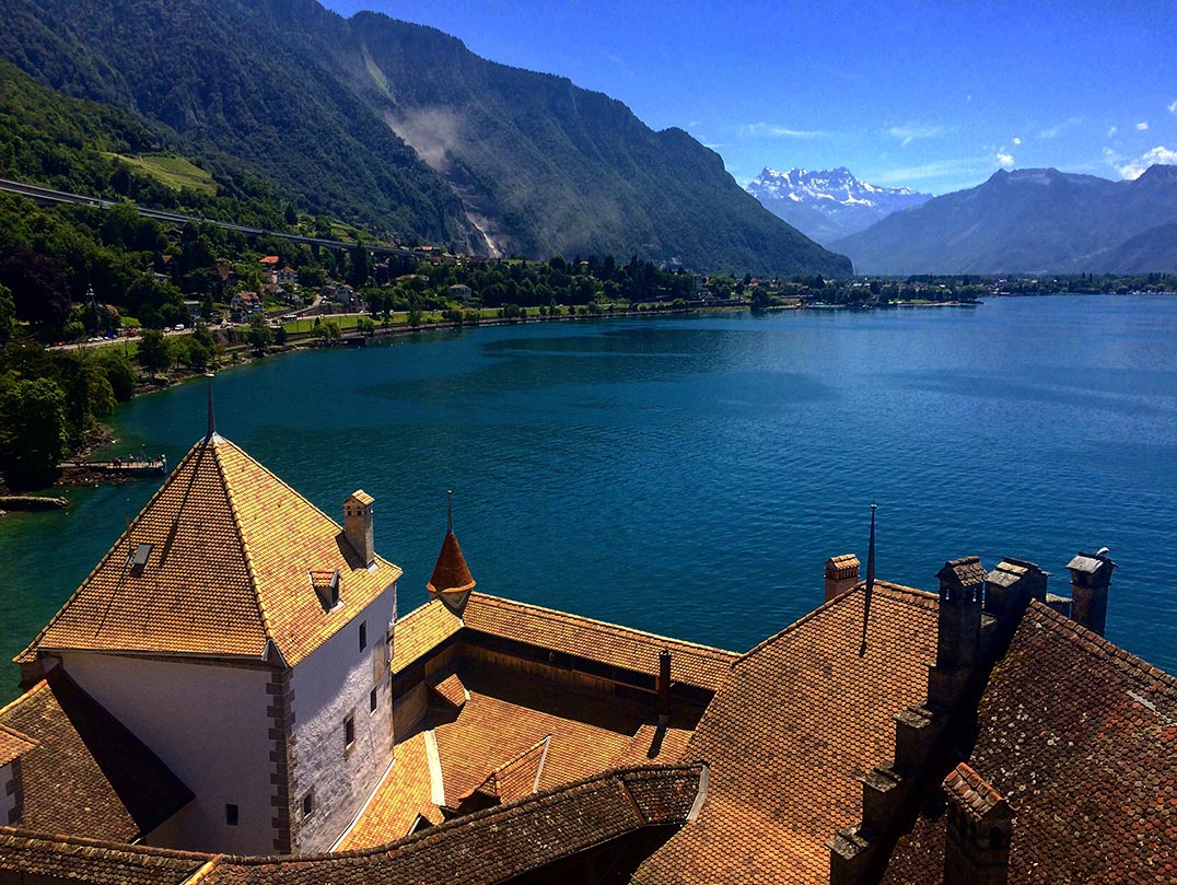 A view of the mountains from the tower of Chateau de Chillon. You can see lake Geneva and the roof of the castle.