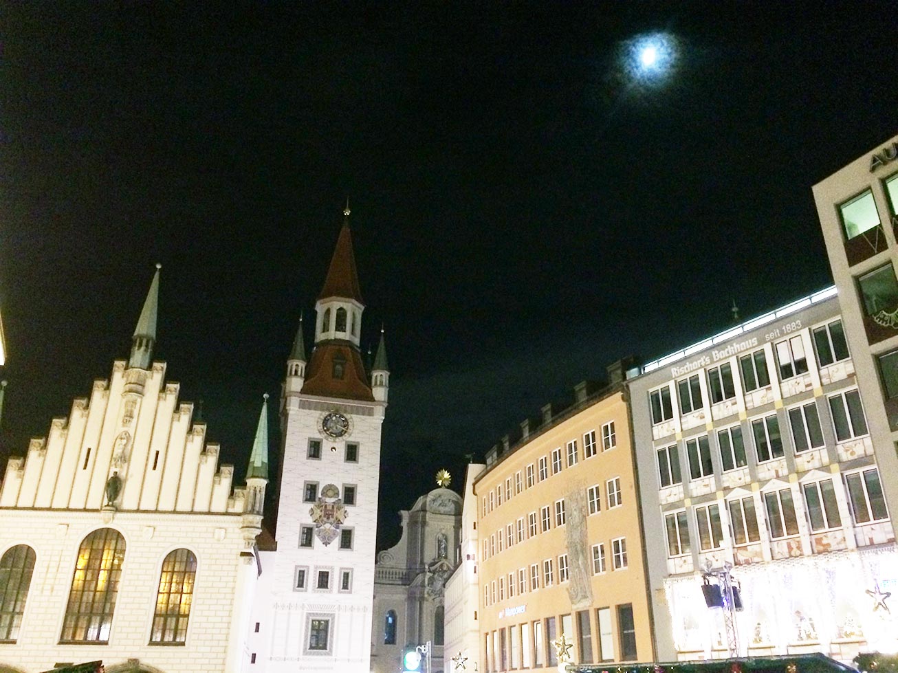 Town Square in Munich, Germany at night with a full moon.