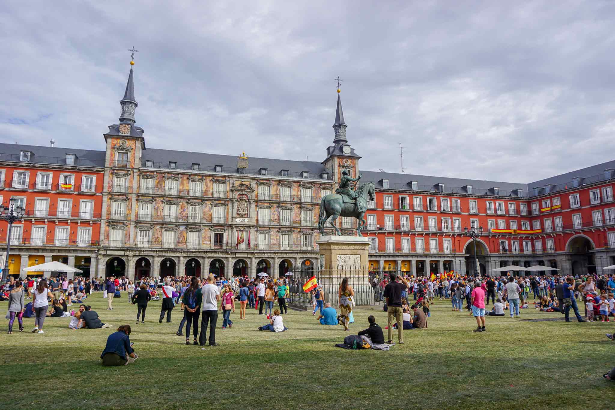 Picture of Plaza Mayor in Madrid, Spain with grass and a lot of people.