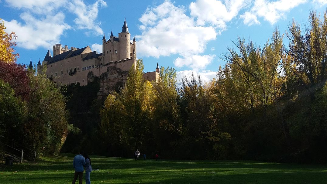 Segovia Castle in Spain seen from a park