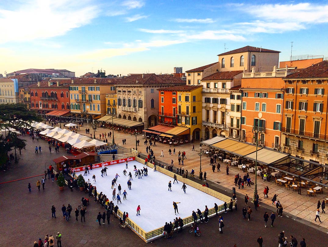 A view of a street and ice rink in Verona, Italy taken from the top of the Roman Ampitheatre.