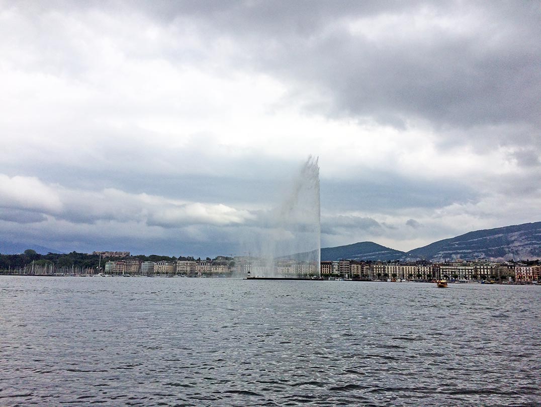 A view of the Jet d'Eau from across the lake. The city of Geneva can be seen in the distance.